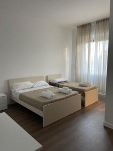 Postel nebo postele na pokoji v ubytování amoR Tempora