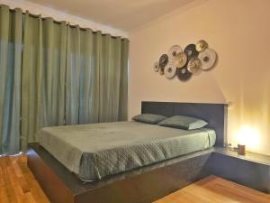 Ένα ή περισσότερα κρεβάτια σε δωμάτιο στο O Sítio da Marta