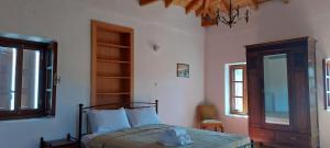 Ένα ή περισσότερα κρεβάτια σε δωμάτιο στο VΛ Village house 'Liodentro'