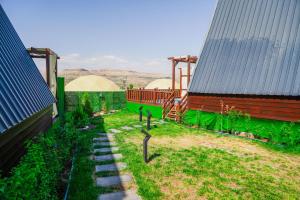 a garden with a pathway next to a building at Green Park Mardin Hotel 
