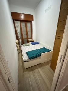 Postel nebo postele na pokoji v ubytování San Siro rooms