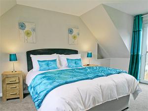 Ένα ή περισσότερα κρεβάτια σε δωμάτιο στο Blackmill Cottage