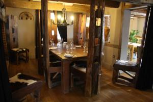 a dining room with a table with glasses on it at The Vernon Pub, Restaurant, Hotel in Moffat