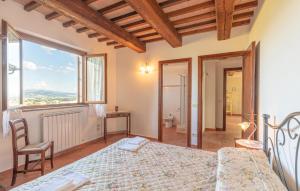 a bedroom with a bed and a large window at Seranna 4 in Papiano