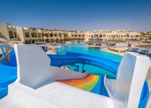 a pool with a rainbow slide at a resort at Sunny Days Palma De Mirette Resort & Spa in Hurghada +45 photos
