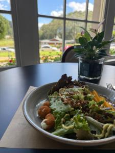 a plate of food sitting on a table at Loft de Mérilen - Palácio Quitandinha in Petrópolis