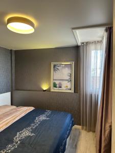 Postel nebo postele na pokoji v ubytování Dona Palace Apartments + 94 fotografií