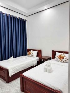 Postel nebo postele na pokoji v ubytování Keomisay Guesthouse