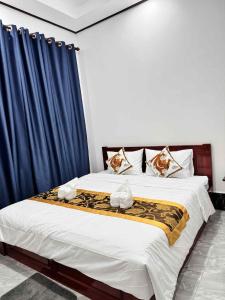 Postel nebo postele na pokoji v ubytování Keomisay Guesthouse