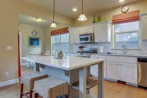 a kitchen with a large white island in a room at Aspen Ridge in Bend