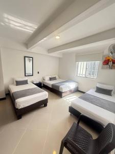 Hospedaje, Medellín,Turismocolombia-fit,Laureles,Estadio,La 70房間的床