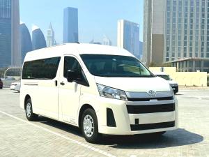 a white van parked in a parking lot at AAli Bus Rental Dubai in Dubai