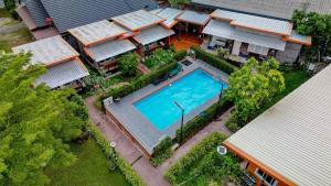 an overhead view of a house with a swimming pool at Da-Kanda Boutique in Klong Muang Beach