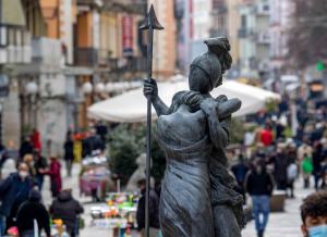 a statue of a woman holding an umbrella at IELLE Suite Brutia in Cosenza