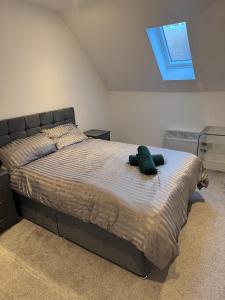 Ένα ή περισσότερα κρεβάτια σε δωμάτιο στο Flat 9 - Epsom High Street