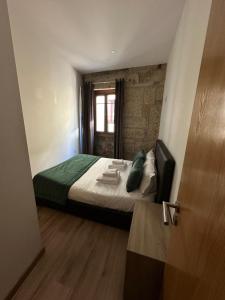 Ένα ή περισσότερα κρεβάτια σε δωμάτιο στο Two 2 Two Urban Stay