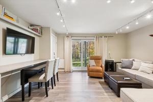 a living room with a couch and a table at Edgemont C1 in Killington Village