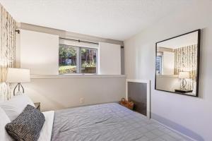 a bedroom with a bed and a large mirror at Edgemont C1 in Killington Village