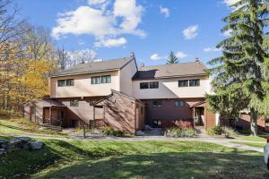 a large white house with a gambrel at Edgemont C1 in Killington Village