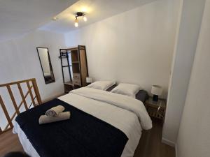 Ένα ή περισσότερα κρεβάτια σε δωμάτιο στο T1 bis Proche Cern Parking Privé