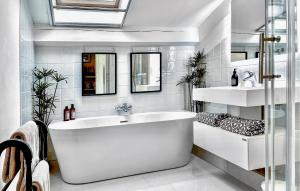 a white bathroom with a tub and a sink at Gorgeous Home In Fontarèches in Fontarèches