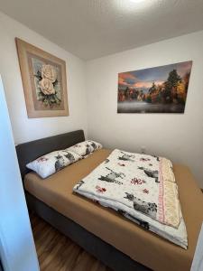 a bedroom with a bed with a quilt on it at Ferienwohnung Franzi in Goslar +15 photos