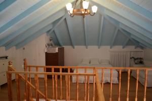 a bedroom with a bed and a blue ceiling at Villa Blu Majestic beach villa in Halki