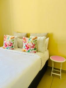 Postel nebo postele na pokoji v ubytování Pink Lopez Guest House