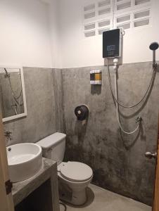 a bathroom with a toilet and a sink and a shower at Mt Olympus Retreat Hotel in Mae Nam +34 photos
