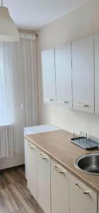 Kuchyň nebo kuchyňský kout v ubytování Apartament 35 Tuchola