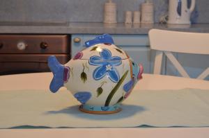 a blue and white vase sitting on a table at Villa Blu Majestic beach villa in Halki