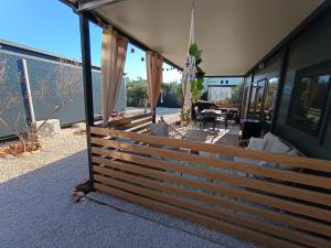a fence on the side of a house at Villa Isabell - Camp Limoni 12 in Sukošan