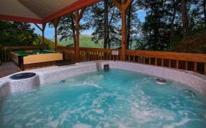a jacuzzi tub in a gazebo at Dream Weaver in De Hart Mill