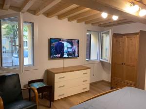 a bedroom with a bed and a tv on the wall at Centrocitta' in Carpi