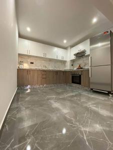 Η κουζίνα ή μικρή κουζίνα στο Résidence al fahimi Agadir