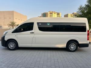 a white van parked in a parking lot at AAli Bus Rental Dubai in Dubai