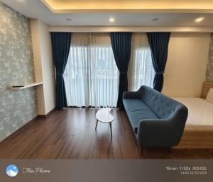 a living room with a couch and a table at Chanhchua Apartment Quy Nhon in Quy Nhon