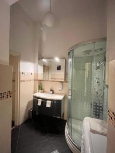 a bathroom with a sink and a shower at Pyvo Street Home with balcony near the Danube in Budapest +37 photos
