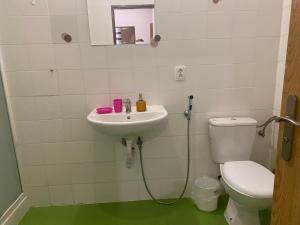 a bathroom with a sink and a toilet at Flat in Center Teplice in Teplice +15 photos