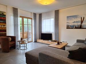 TV a/nebo společenská místnost v ubytování Appartement Jade