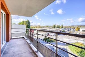 a balcony with a view of a parking lot at Canal de Yvette in Longjumeau