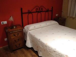 A bed or beds in a room at El Molin de Eloy