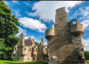 an old castle with two baskets on top of it at No 2 High Park Lodges in Orkney