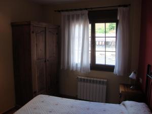 A bed or beds in a room at El Molin de Eloy