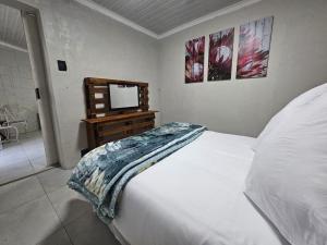 Ένα ή περισσότερα κρεβάτια σε δωμάτιο στο Sally's Place