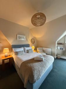 a bedroom with a large bed and two lamps at The Albany Rooms Bexhill in Bexhill +45 photos