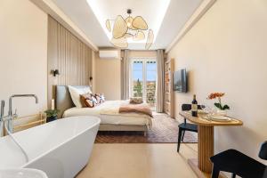a bathroom with a tub and a bed with a window at Nice Renting - HUGO - Luxury Honeymoon Suite Terrace Park View Free Parking in Nice