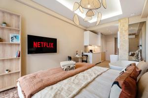 a bedroom with a large bed and a bathroom at Nice Renting - HUGO - Luxury Honeymoon Suite Terrace Park View Free Parking in Nice