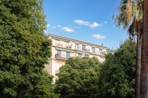 a building with trees in front of it at Nice Renting - HUGO - Luxury Honeymoon Suite Terrace Park View Free Parking in Nice