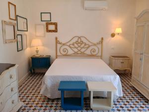 Ένα ή περισσότερα κρεβάτια σε δωμάτιο στο La Dimora del Borgo